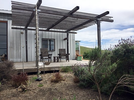 main-barn-and-deck-and-barking-dog