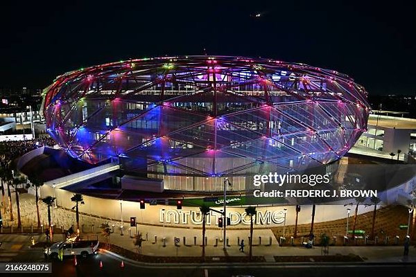 006 - TOPSHOT - The new Intuit Dome is illuminated on opening night in Inglewood, California, August 15, 2024. The Intuit Dome is an indoor arena, home of the Los Angeles Clippers of the National Basketball Association (NBA) and host venue for the 2028 Olympic Games. (Photo by Frederic J. Brown / AFP) (Photo by FREDERIC J. BROWN/AFP via Getty Images)
